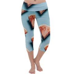 Watermelon Against Blue Surface Pattern Capri Yoga Leggings by artworkshop